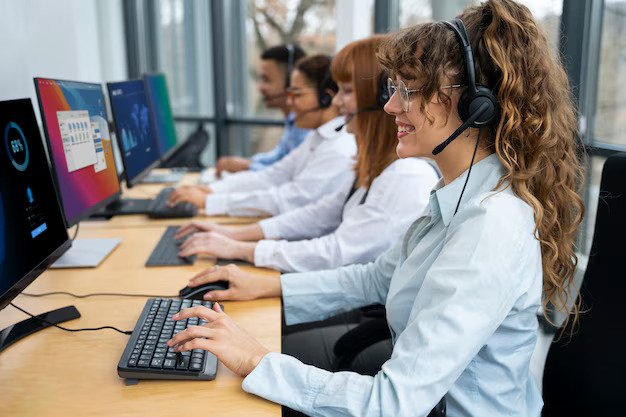 CallConnect team collaborating at their workstations